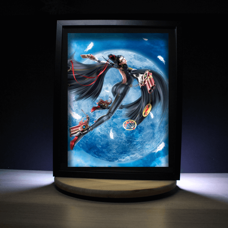 Diorama lumineux Bayonetta en vol devant la pleine lune, déco murale gaming